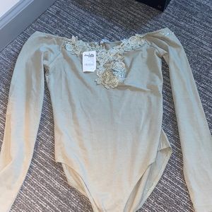 Green lace body suit